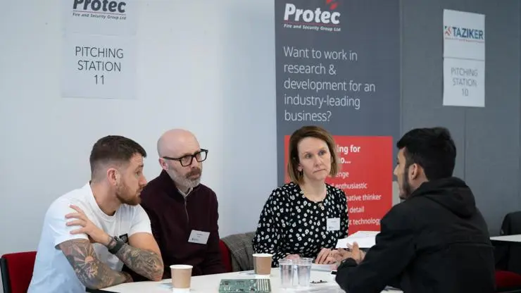 Protec employees interviewing a young person in a speed pitching session.