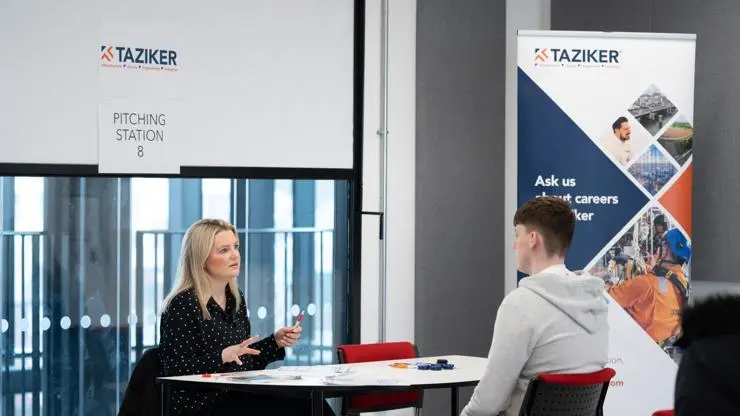 Taziker employees interviewing a young person.