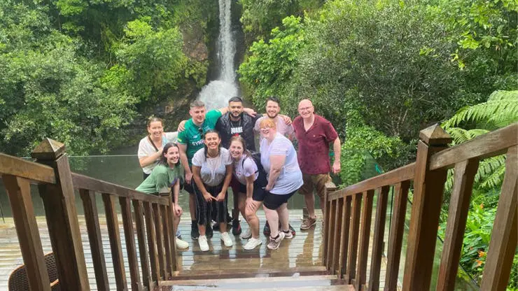 International Tourism Management students stop by waterfall on field trip