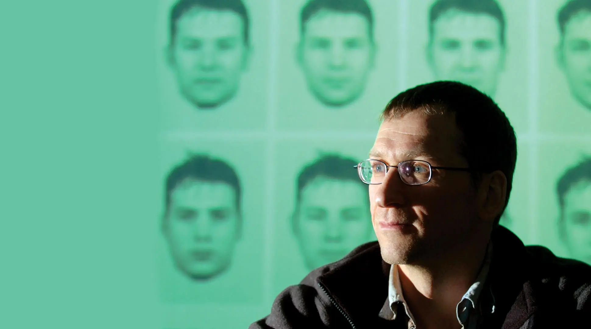 man sat in front of a screen of evofit facial composites