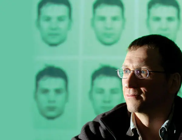 man sat in front of a screen of evofit facial composites