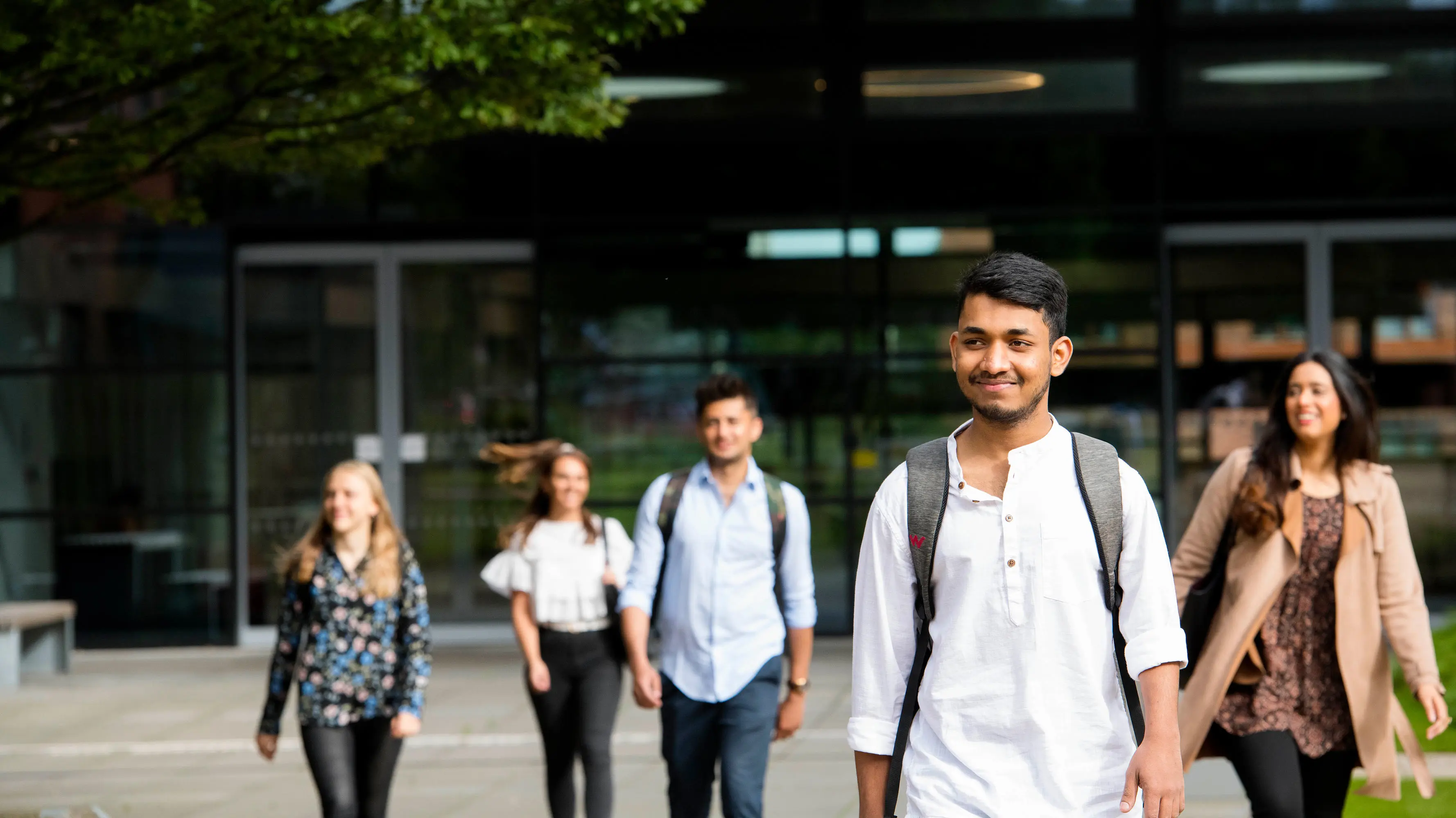 International students walking through campus