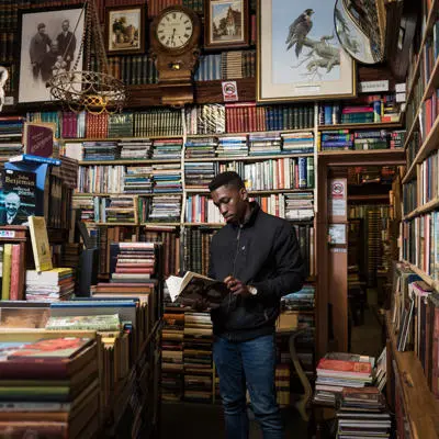 Student reading in a second-hand bookshop