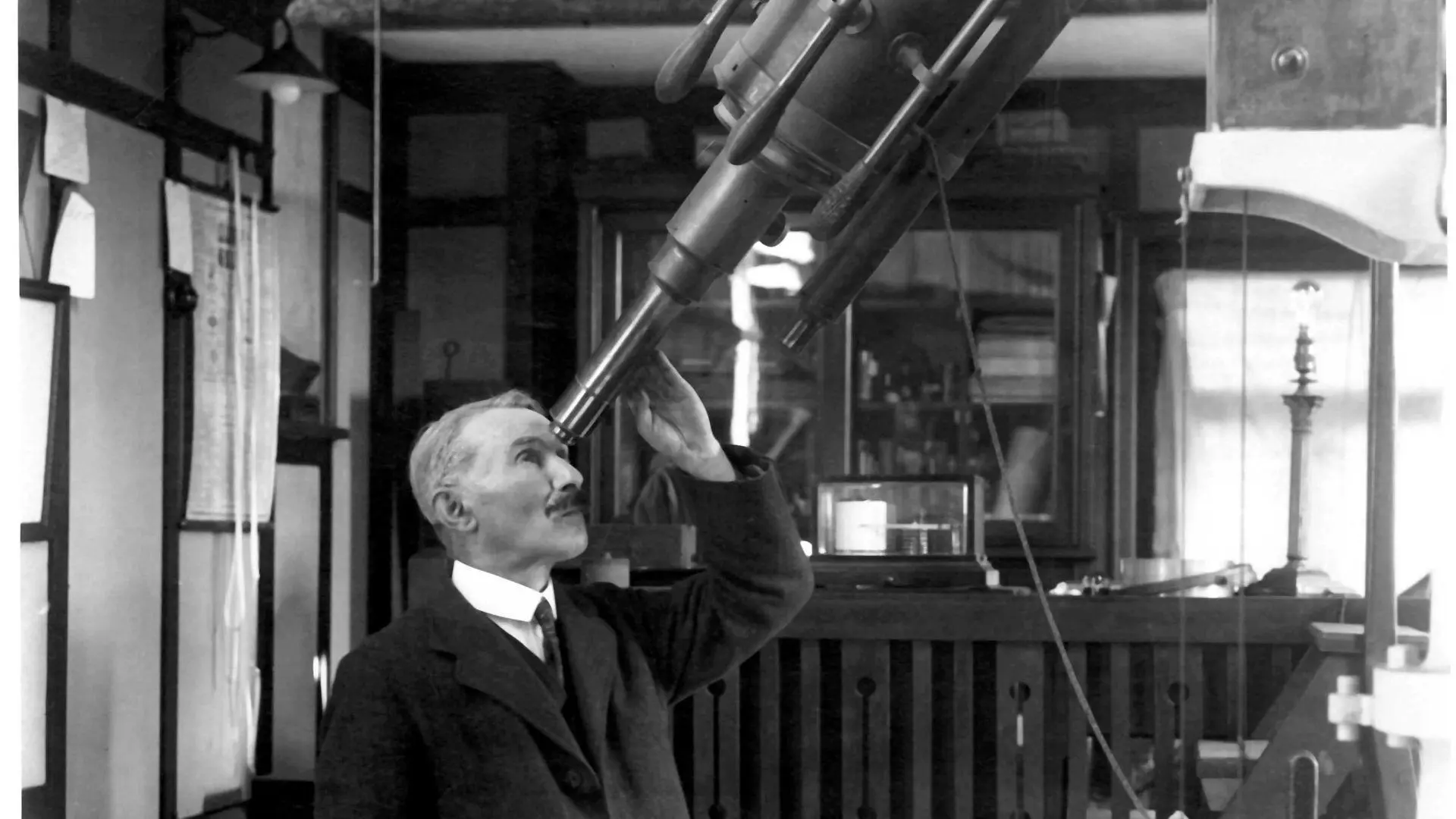George Gibbs using a telescope