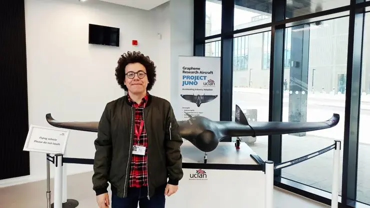 Muhammad Elafifi standing in front of aircraft exhibition in the EIC building
