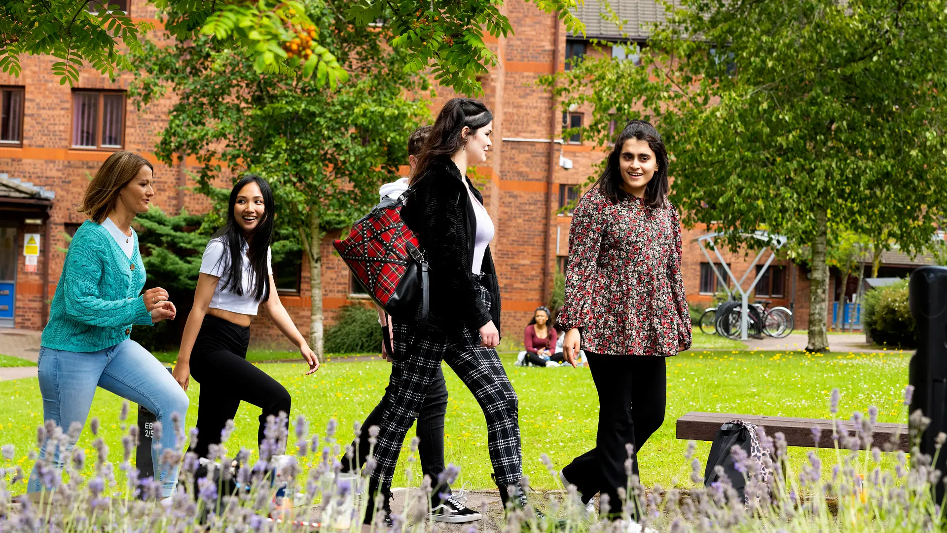 A group of students walking in front of Ribble Hall