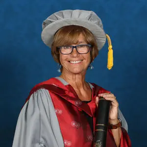 Honorary doctorate wearing cap and gown