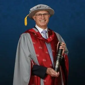man in doctorate graduation robe