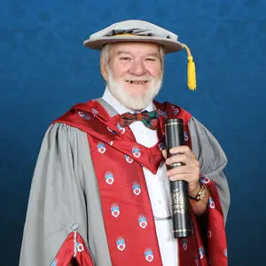 John Fyfe in graduation gown with Honorary Doctorate