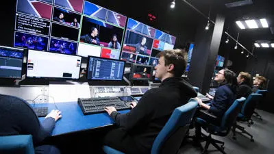 A group of students operating a video mixing gallery.