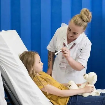 nurses examining patient