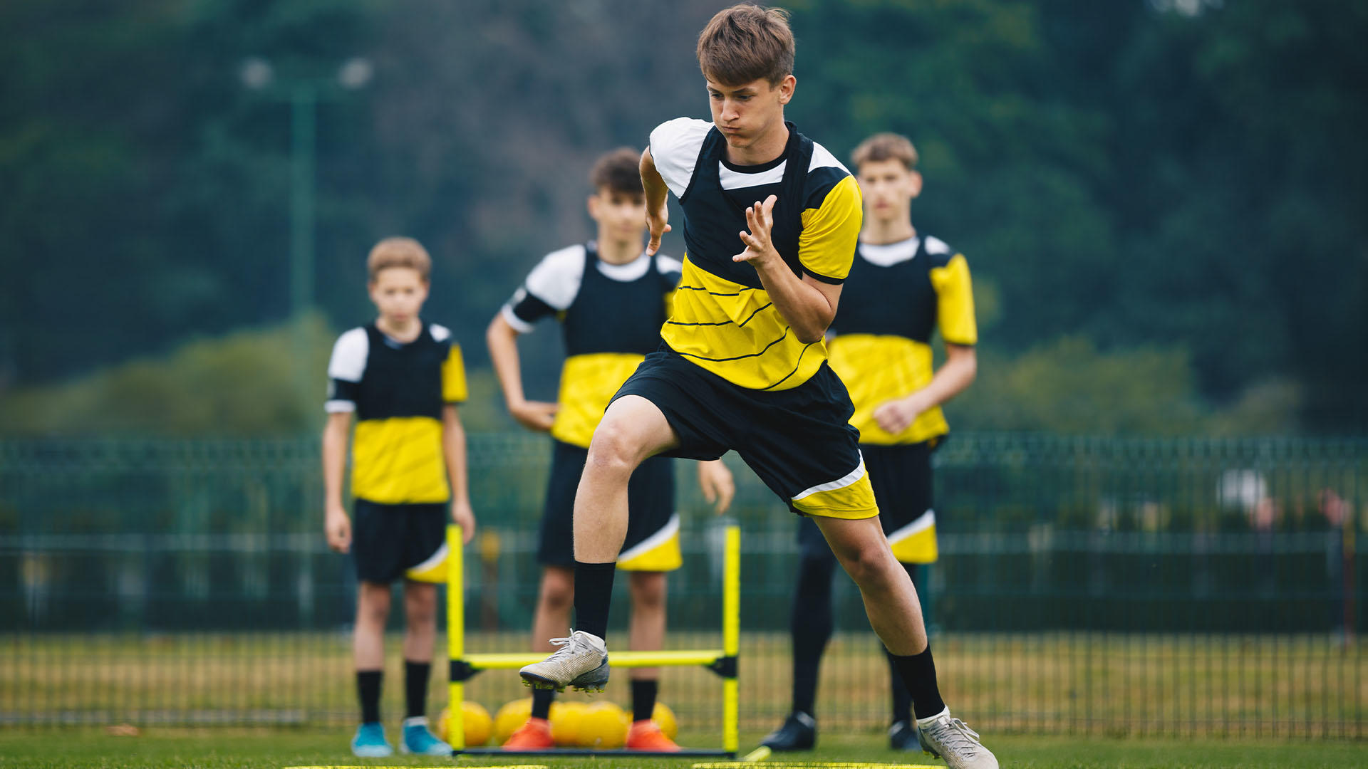 Adolescents training on football ground