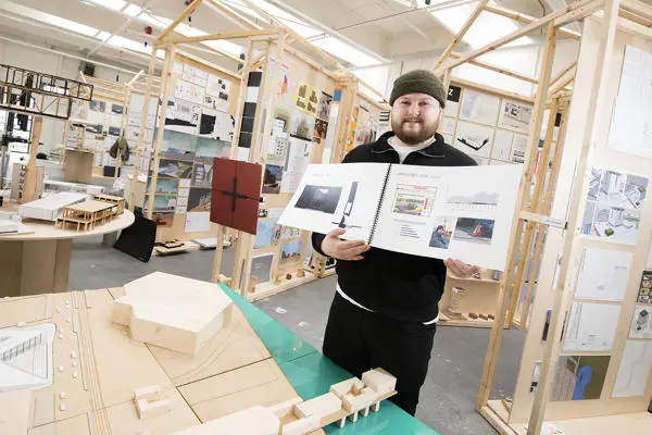 Student showing work for architectural studies bsc