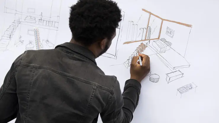 Student working on an architectural drawing