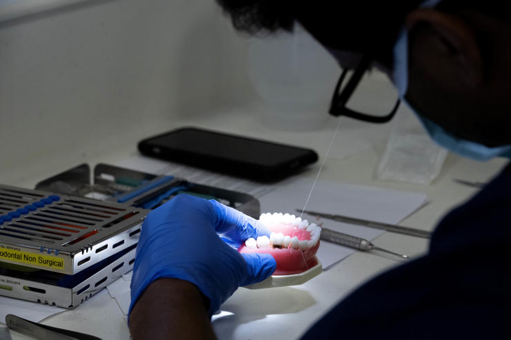 A BDSI student seen working on teeth