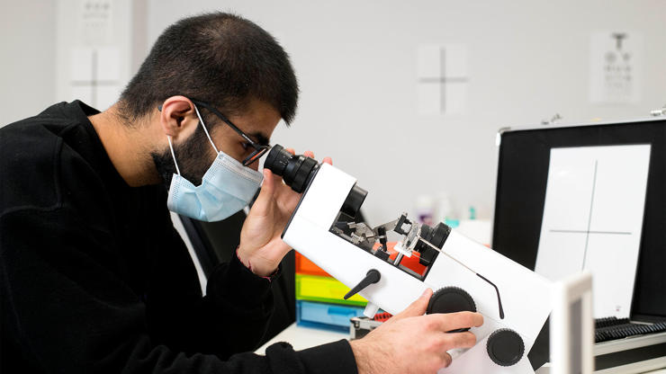 Student using eye test equipment 
