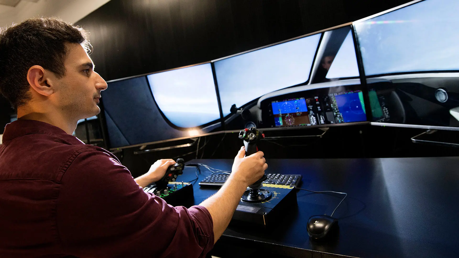 student flying in a flight simulator