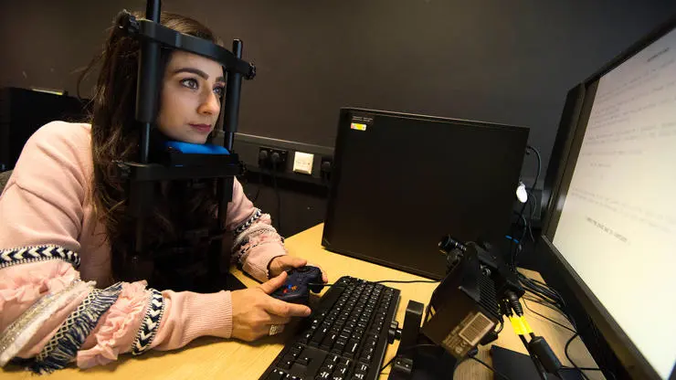 Psychology student using eye-tracking equipment