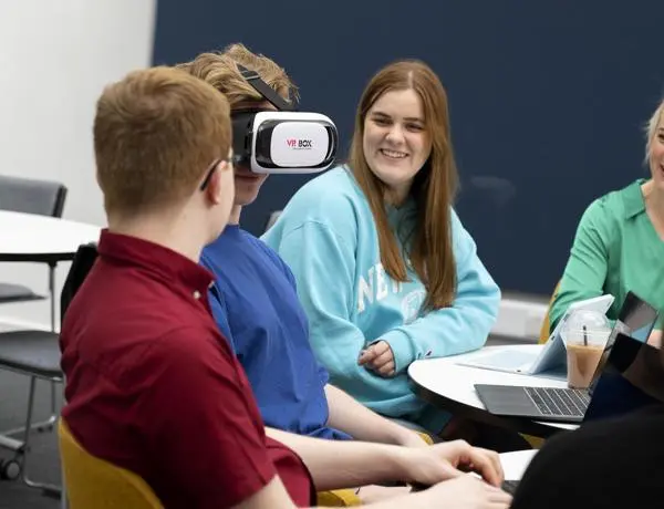 students watching another with a vr headset