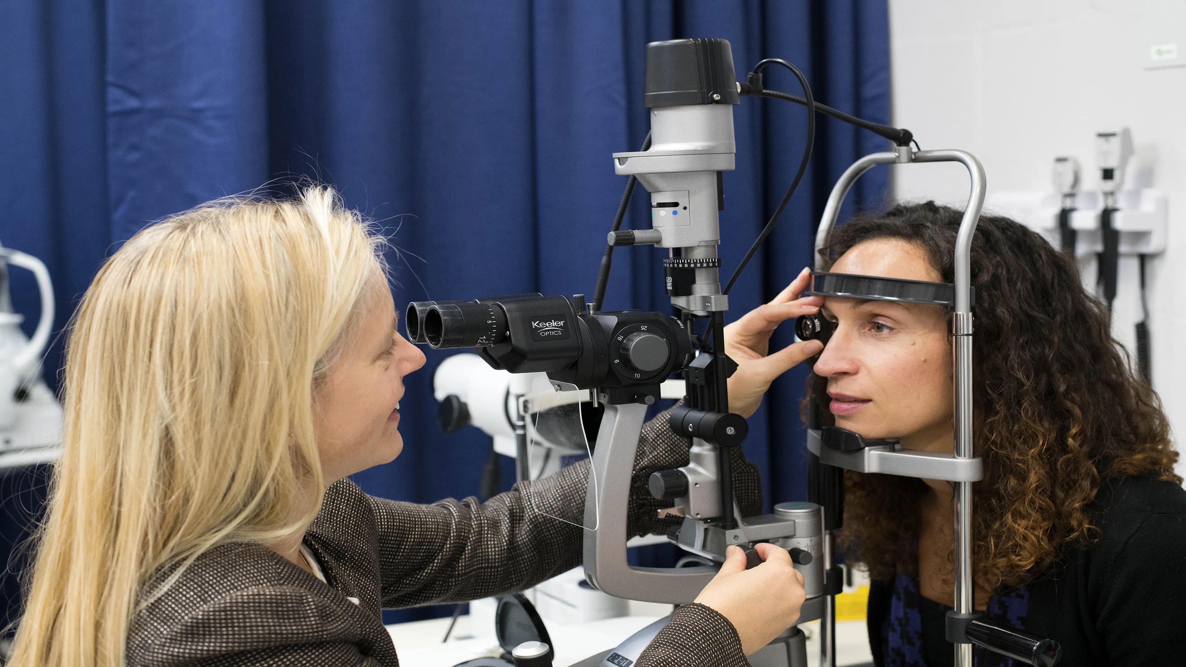 Person having eye examined by optician