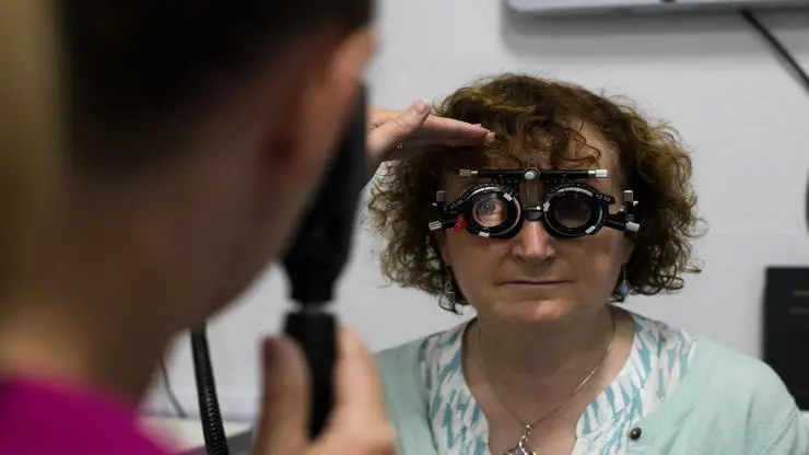 Person undergoing optometry exam
