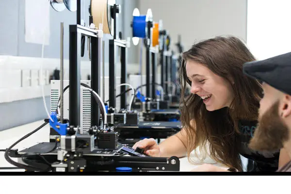 Two students on 3D printer
