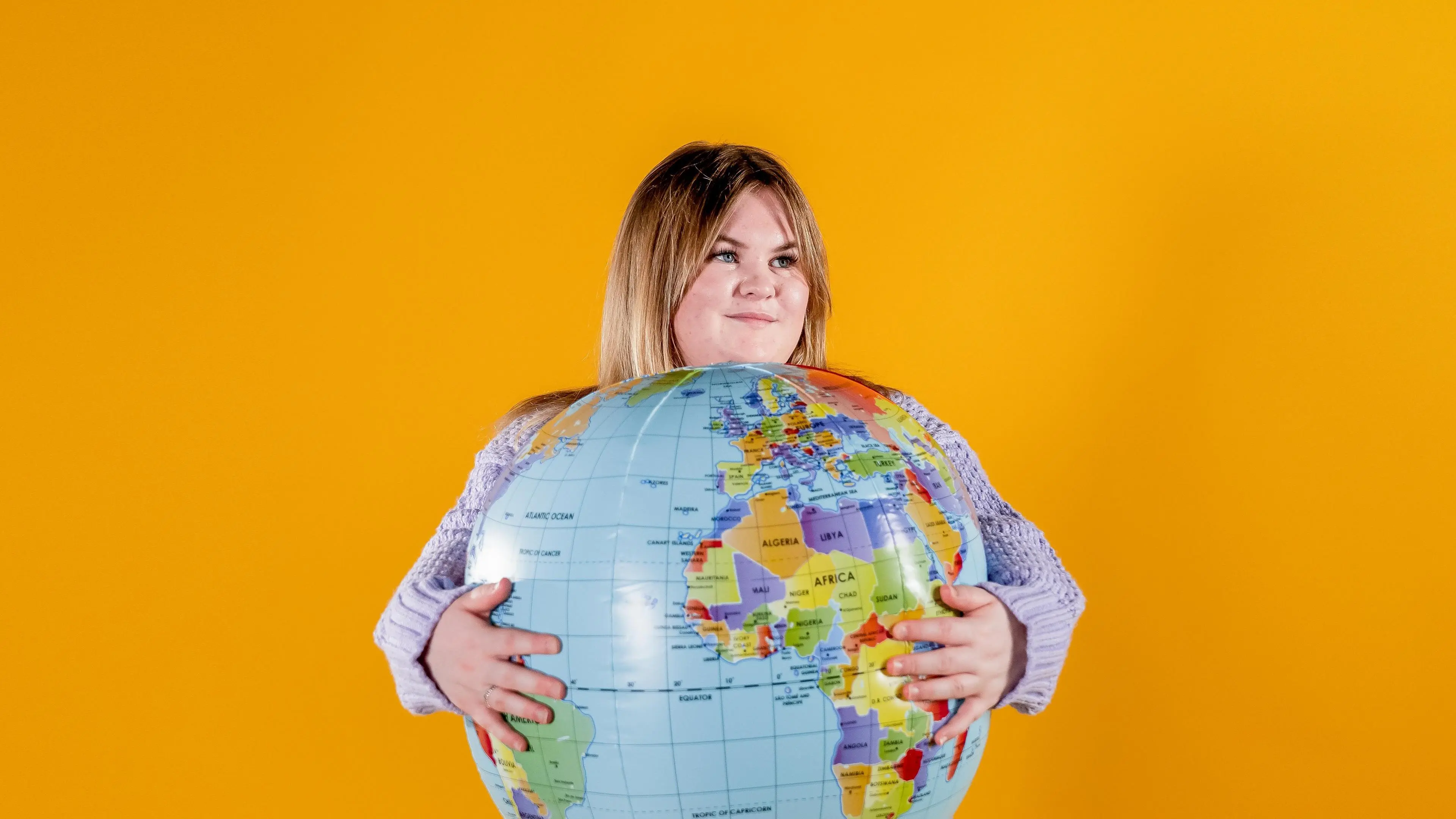 Jess Holden holding globe