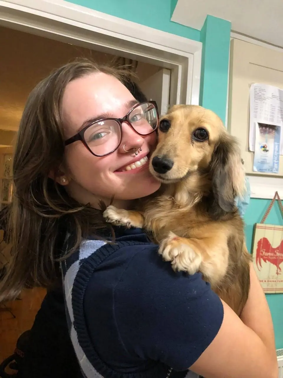 Photo of Sophie-Jade smiling with dog