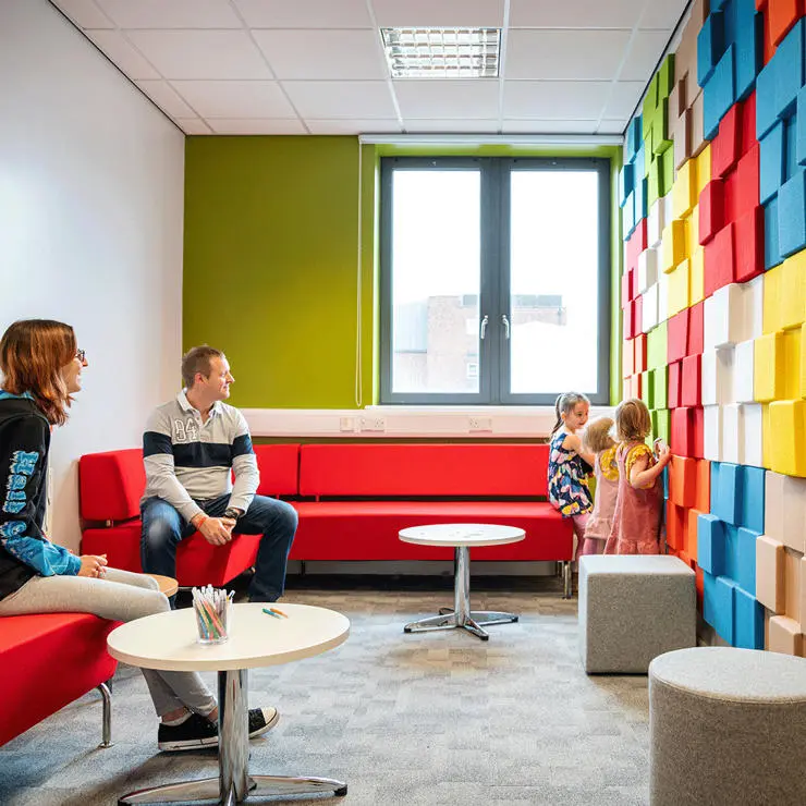 Our waiting room is full of colour with its multicoloured block wall.