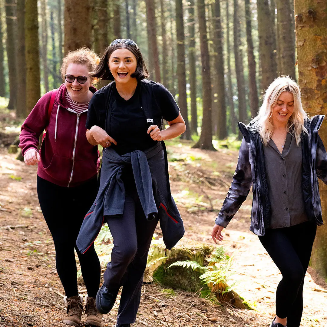 Students walk through woods