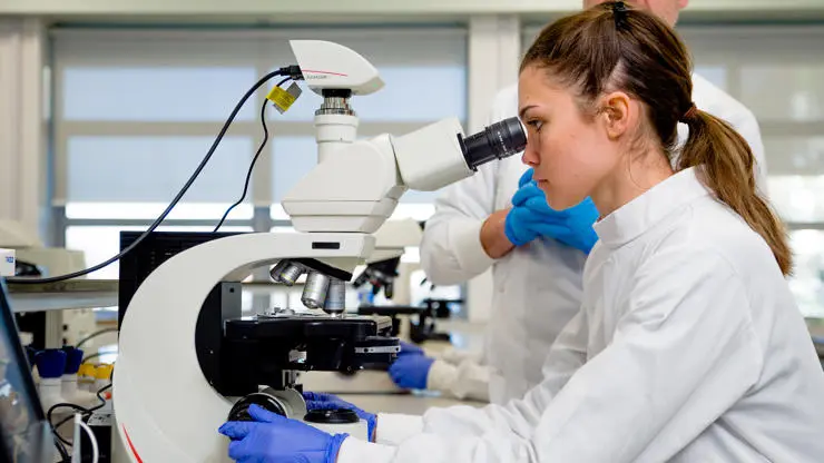 Bioveterinary sciences student using a microscope