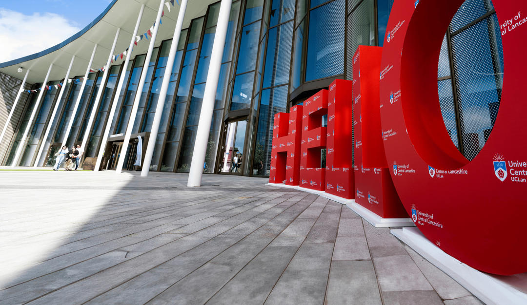 exterior photo of the student centre with big red hello letters