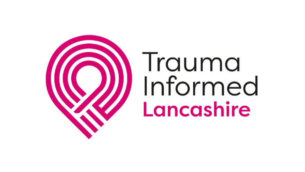 trauma informed logo with grey and pink writing and a pink motif design