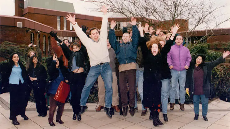 Students jumping for joy in the 1990s