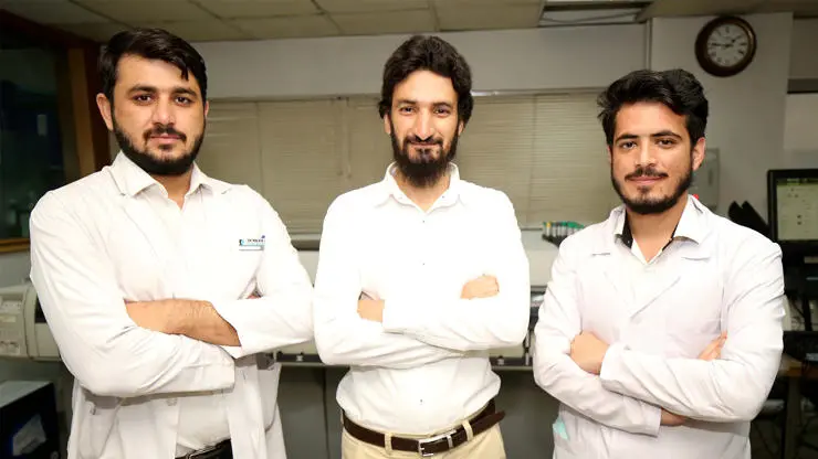Babar with laboratory colleagues, Mansoor and Mujahid