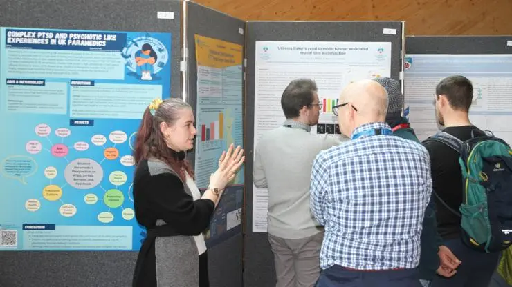 Students sharing their work with colleagues and researchers at the Research and Knowledge Exchange Festival.