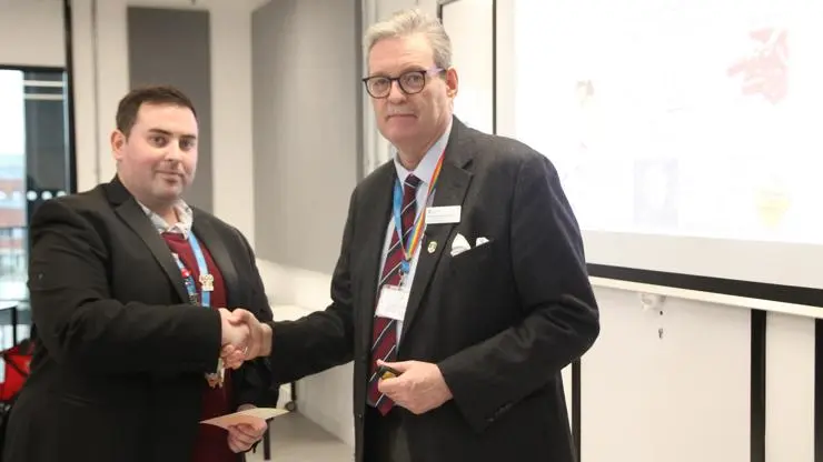 Pro Vice Chancellor (Research and Enterprise) Professor StJohn Crean presenting an award to Stephane Bernau.