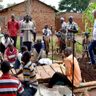 People sitting around in Ugandan village
