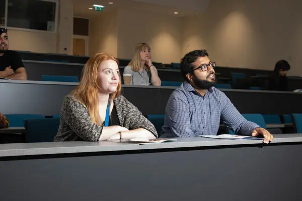 Postgraduate students in lecture theatre