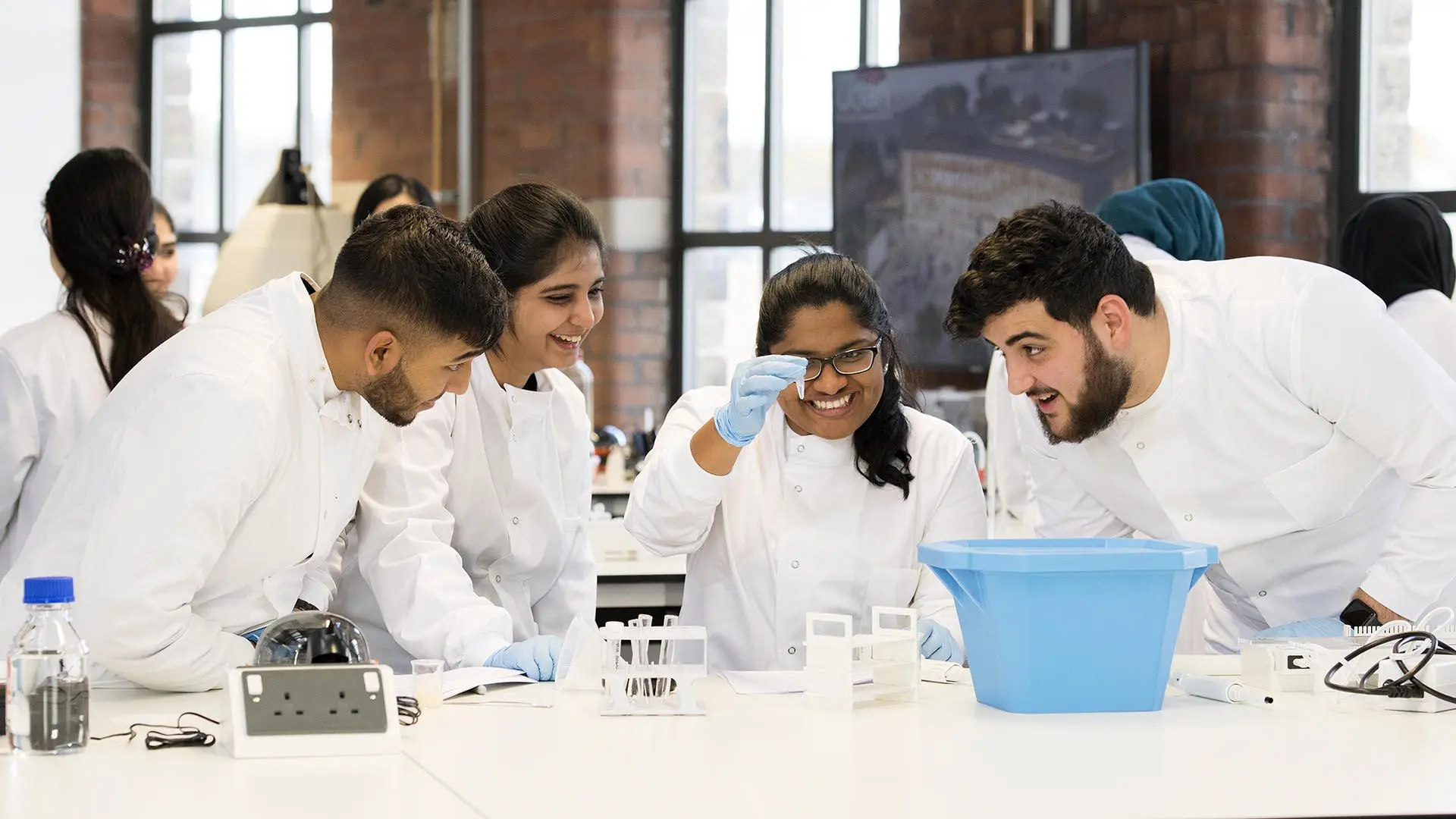A group of bioscience students conduct an experiment