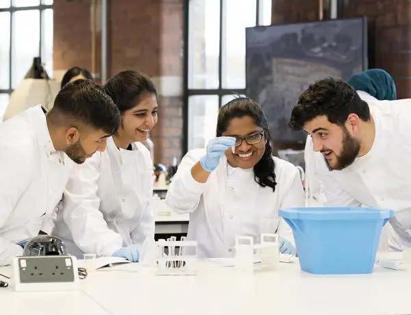 A group of bioscience students conduct an experiment