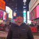 Sports Journalism student Adam Proud standing in Times Square, New York City