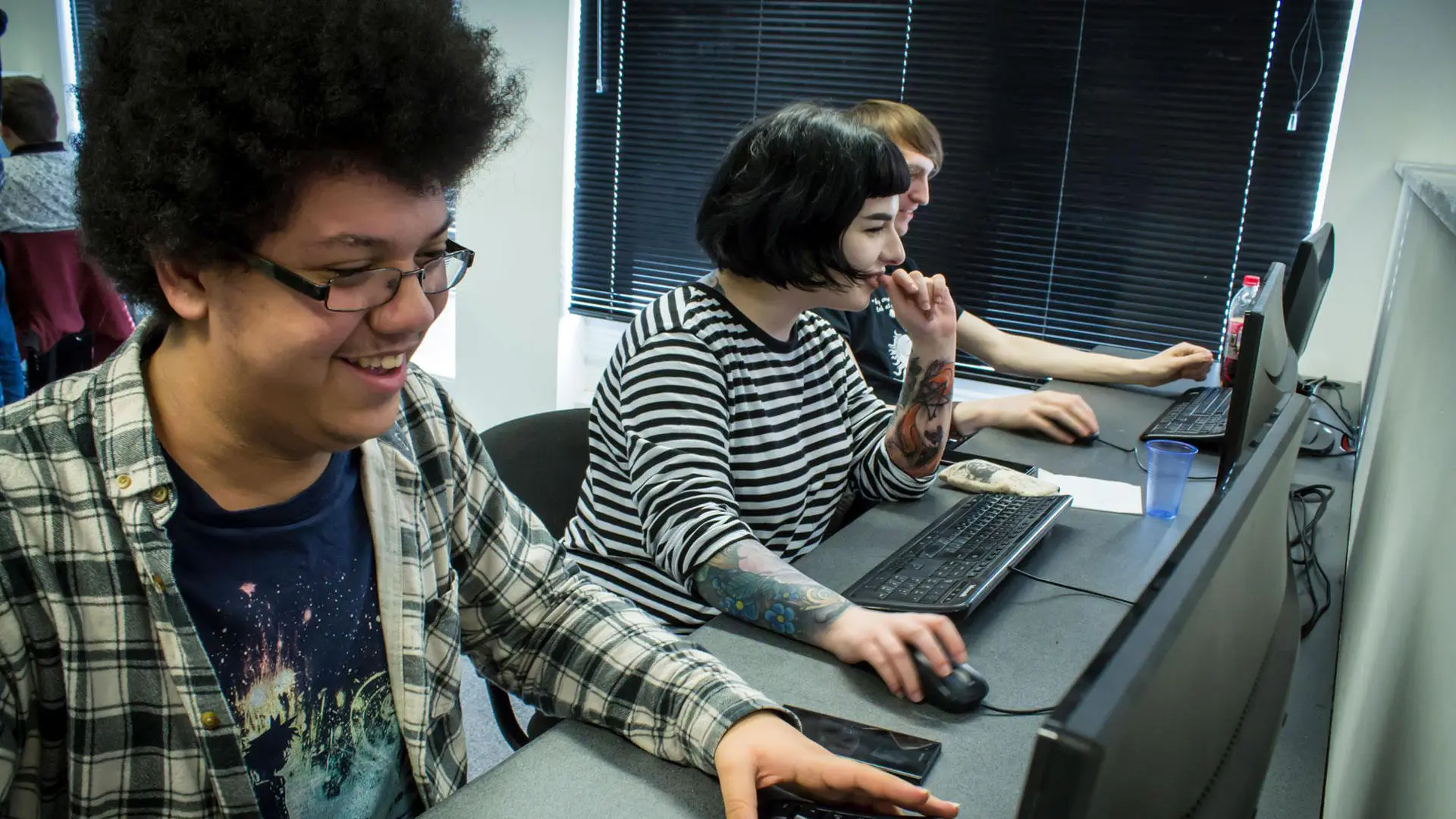 Students working happily at computers