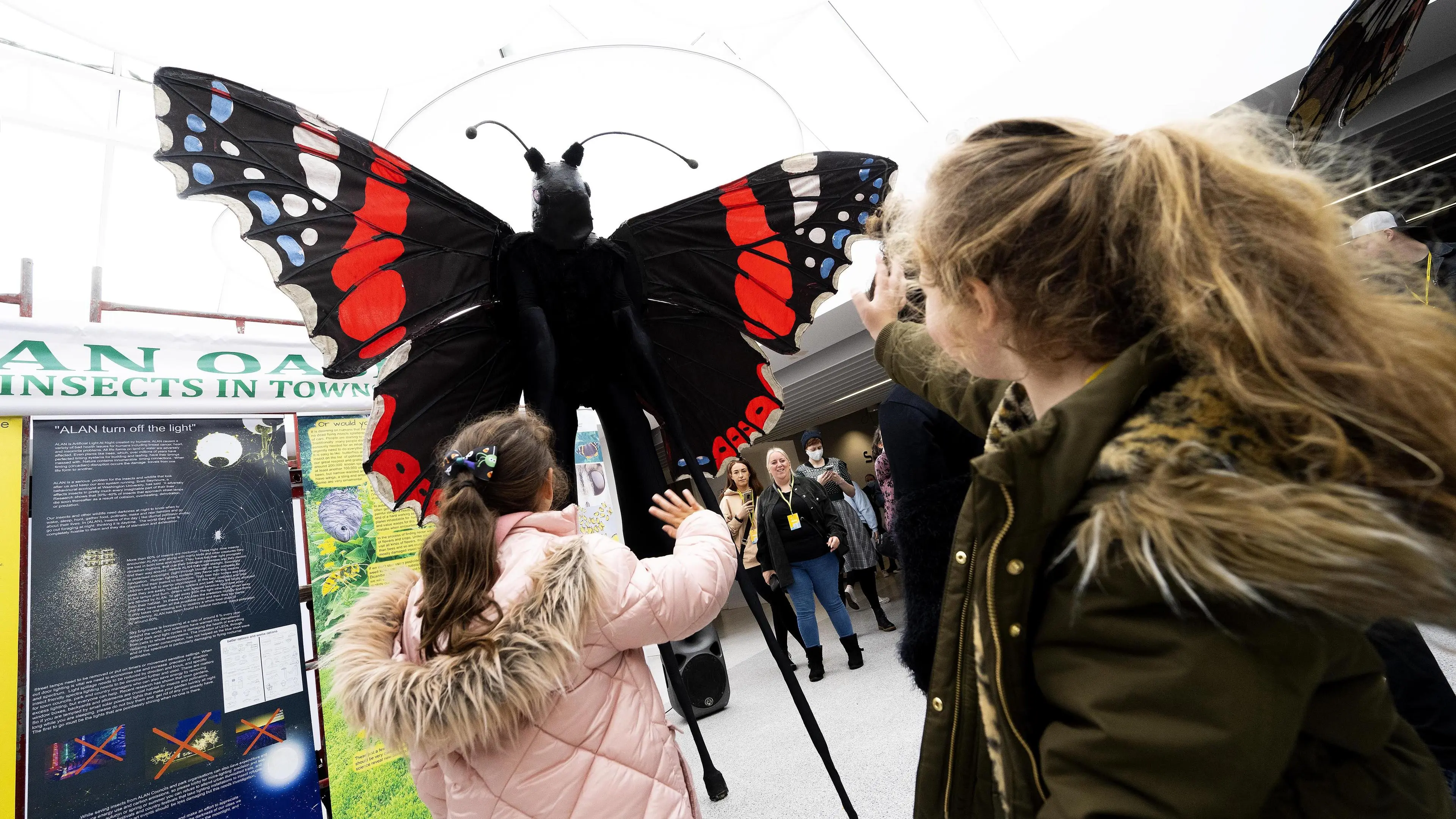 children looking at a giant butterfly at Lancashire Science Festival in 2021