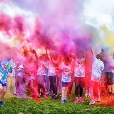 Children in a cloud of powder paint at UCLan Colour Run event