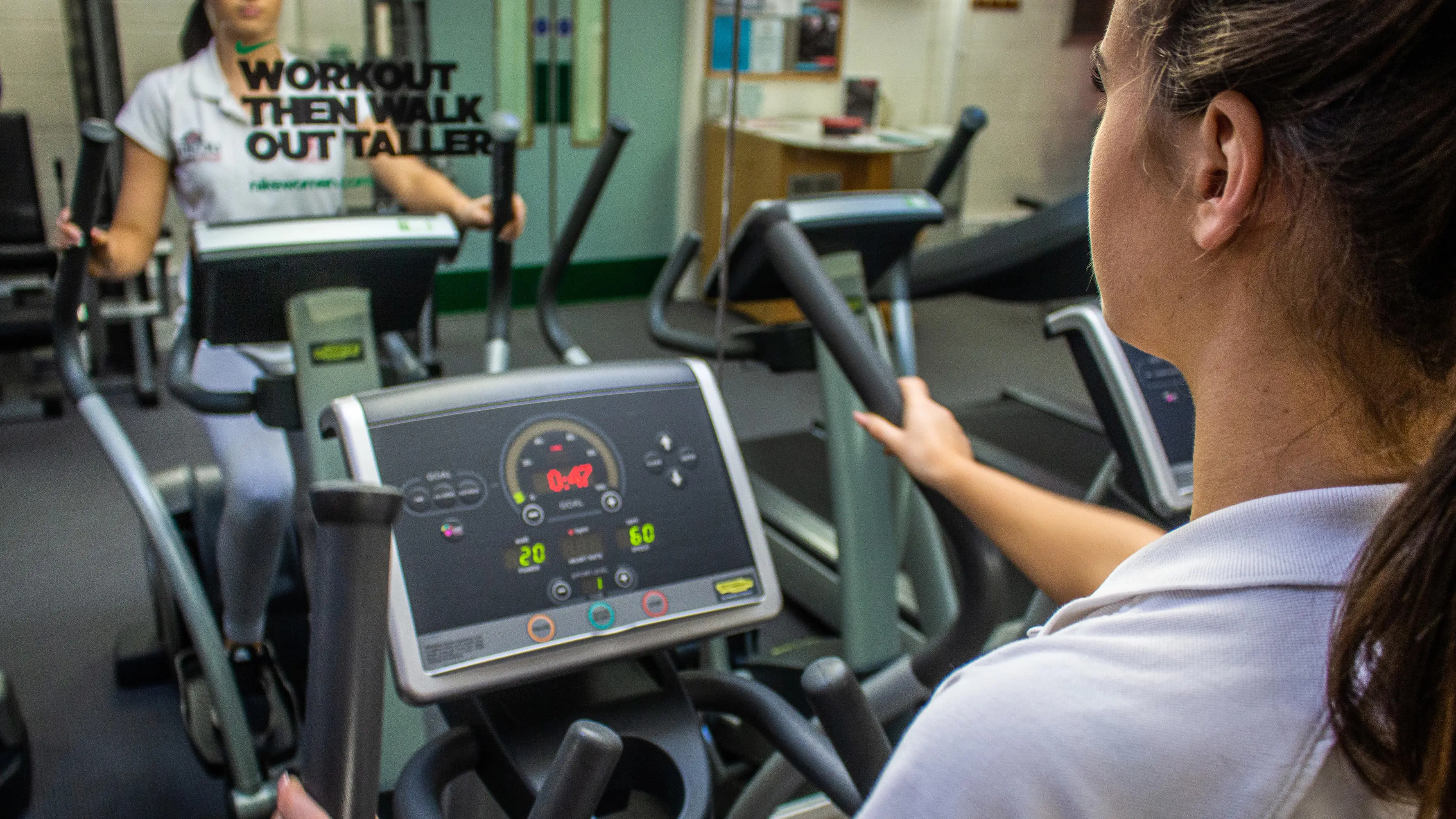 Using a cross trainer in the UCLan Sports Arena gym
