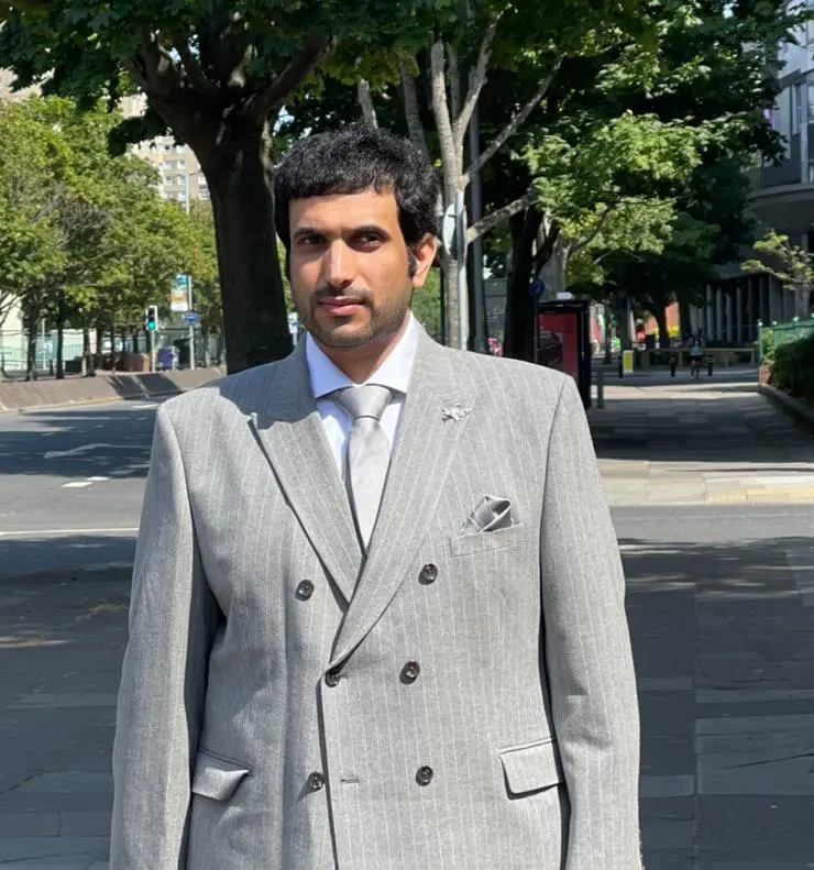 Hmad Rashid Sobaih in a grey suit