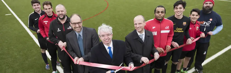 Mark Menzies MP cutting the ribbon to officially open the 3G pitch at the UCLan Sports Arena