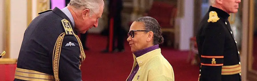 Lubaina Himid being presented her CBE by Prince Charles