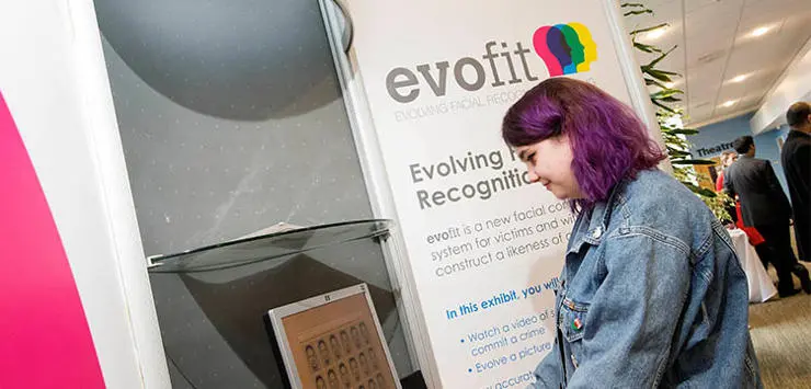 Student looking at an evofit stand